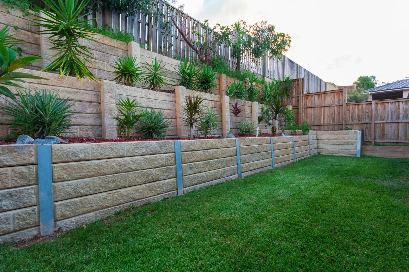 Concrete retaining wall on a sloped Northern Beaches block