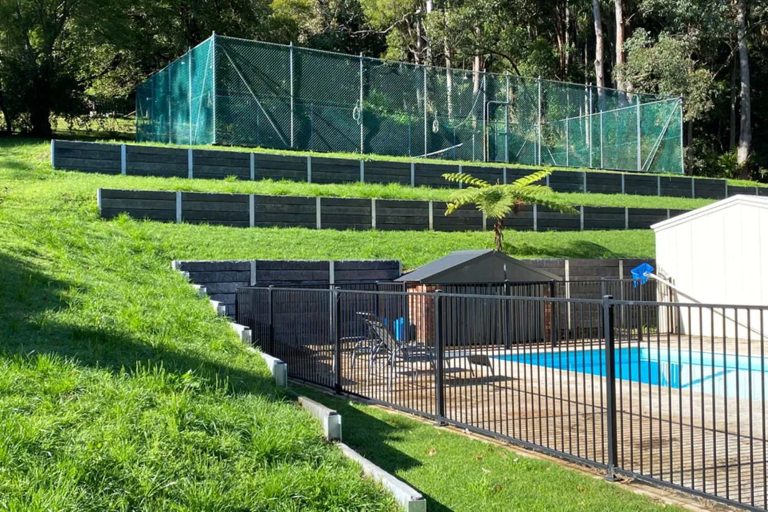 Steel-post concrete sleeper retaining wall