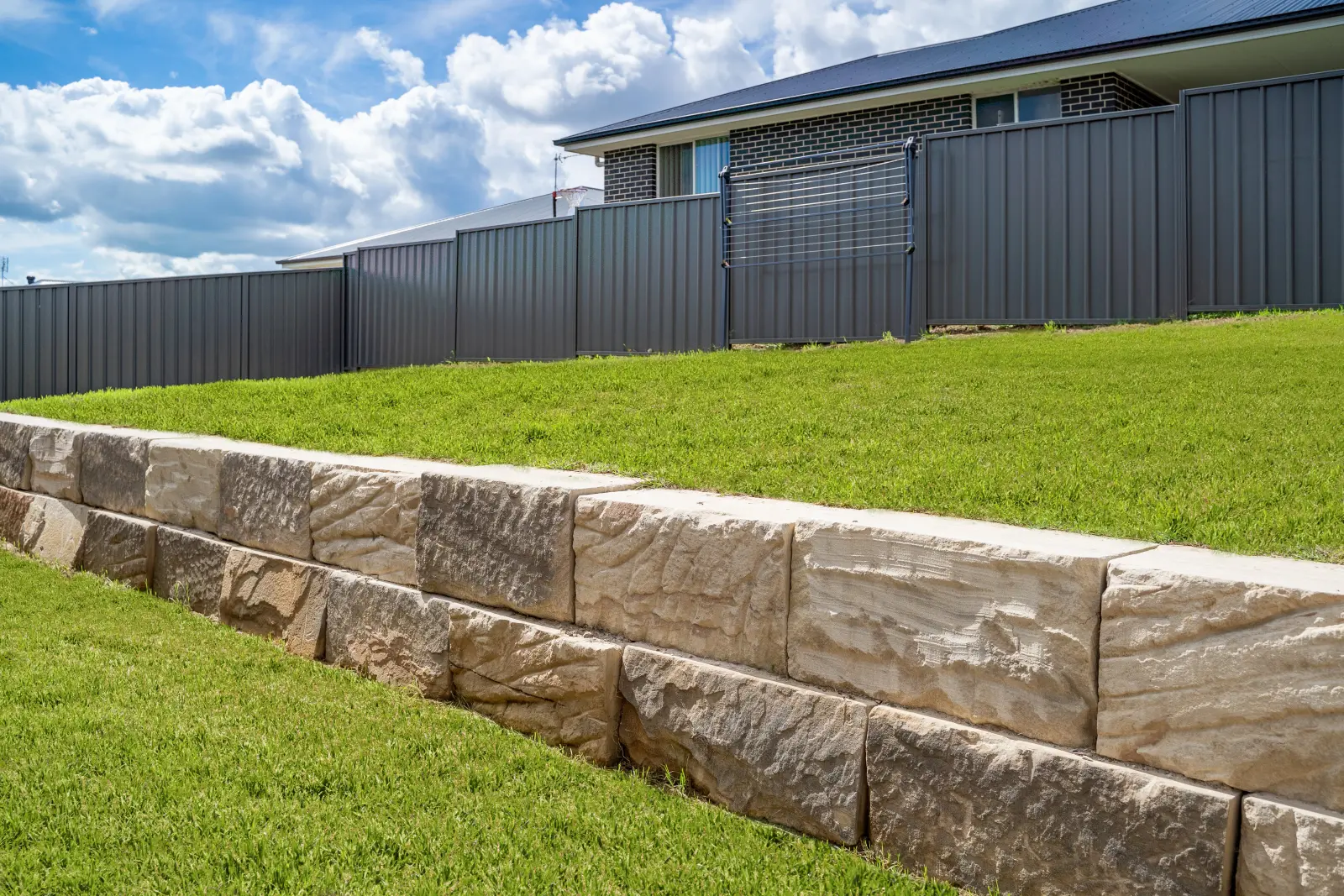 Sawn sandstone block retaining wall on a Manly property